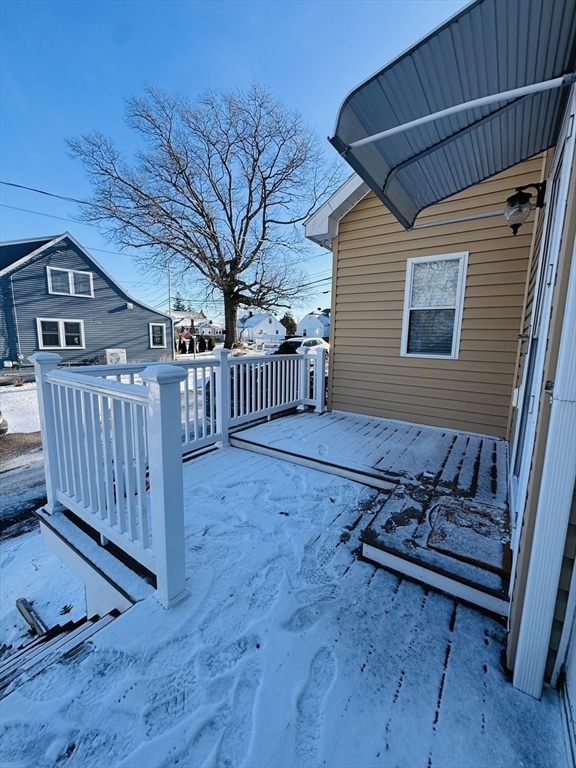 162 Palmer Street Quincy, MA 02169 - Photo 19 of 21 a backyard of a house with table and chairs