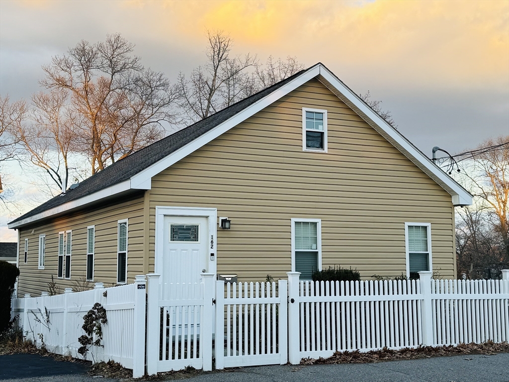 162 Palmer Street Quincy, MA 02169 - Photo 2 of 21 a view of a house with a fence