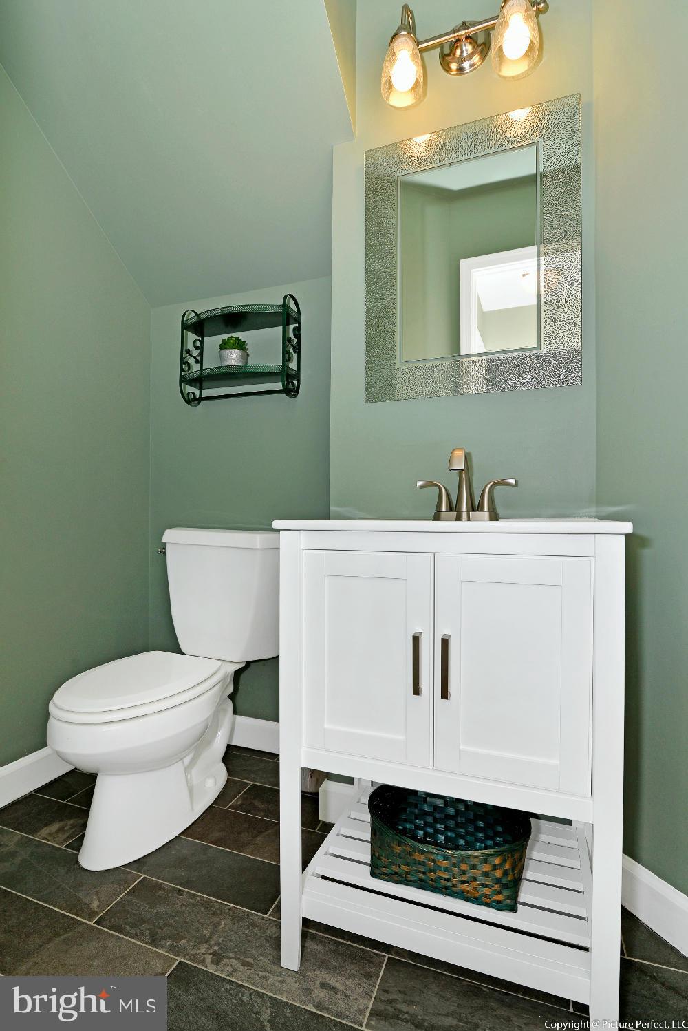 2488 Bear Den Road Frederick, MD 21701 - Photo 16 of 30 a bathroom with a sink toilet and mirror