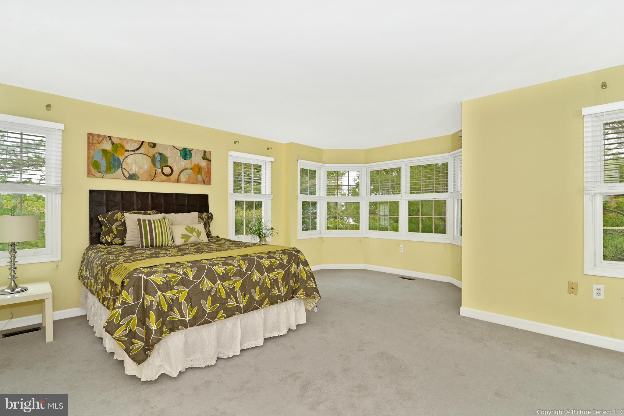 2488 Bear Den Road Frederick, MD 21701 - Photo 17 of 30 a spacious bedroom with a bed and a window