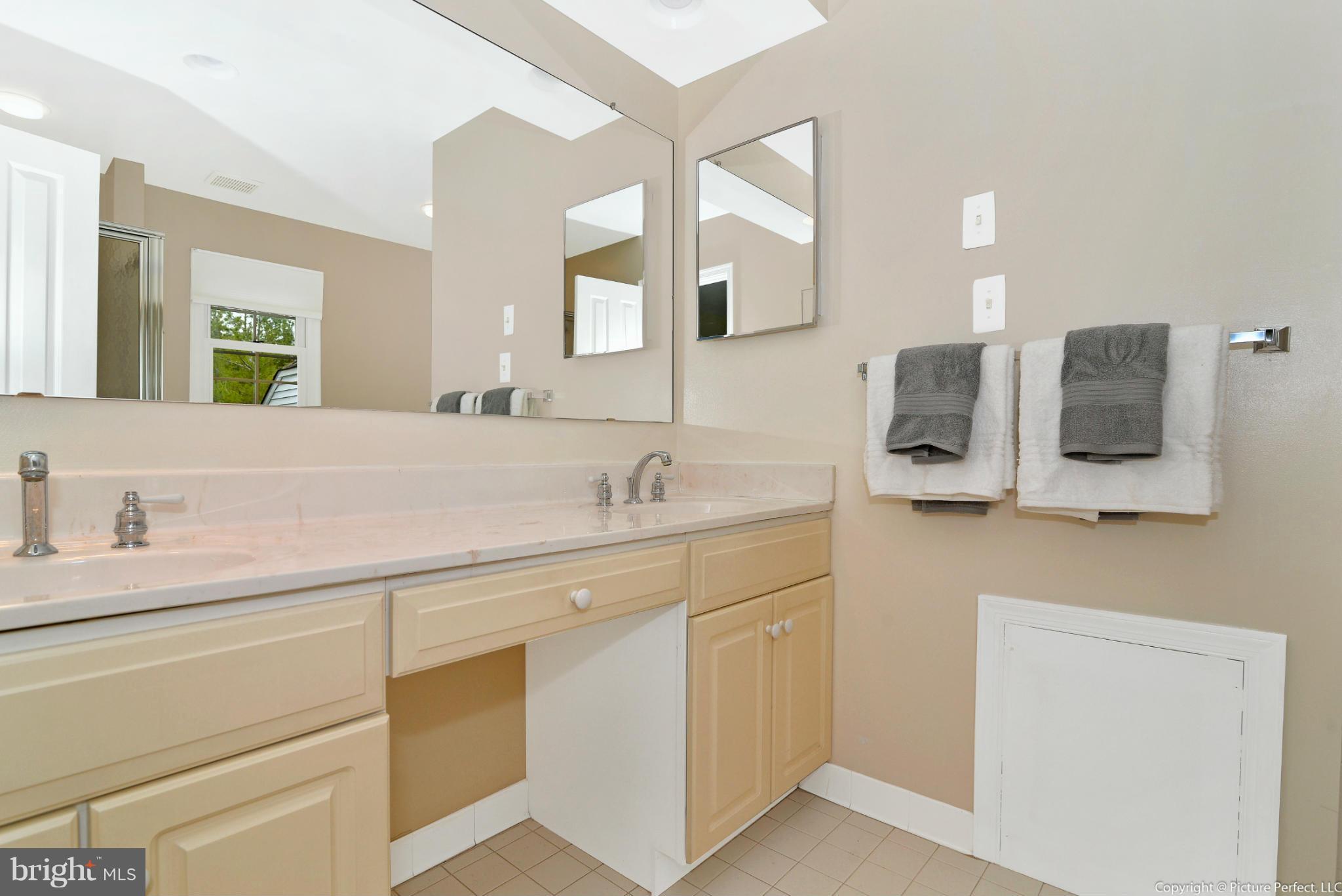 2488 Bear Den Road Frederick, MD 21701 - Photo 19 of 30 a bathroom with a sink and a mirror