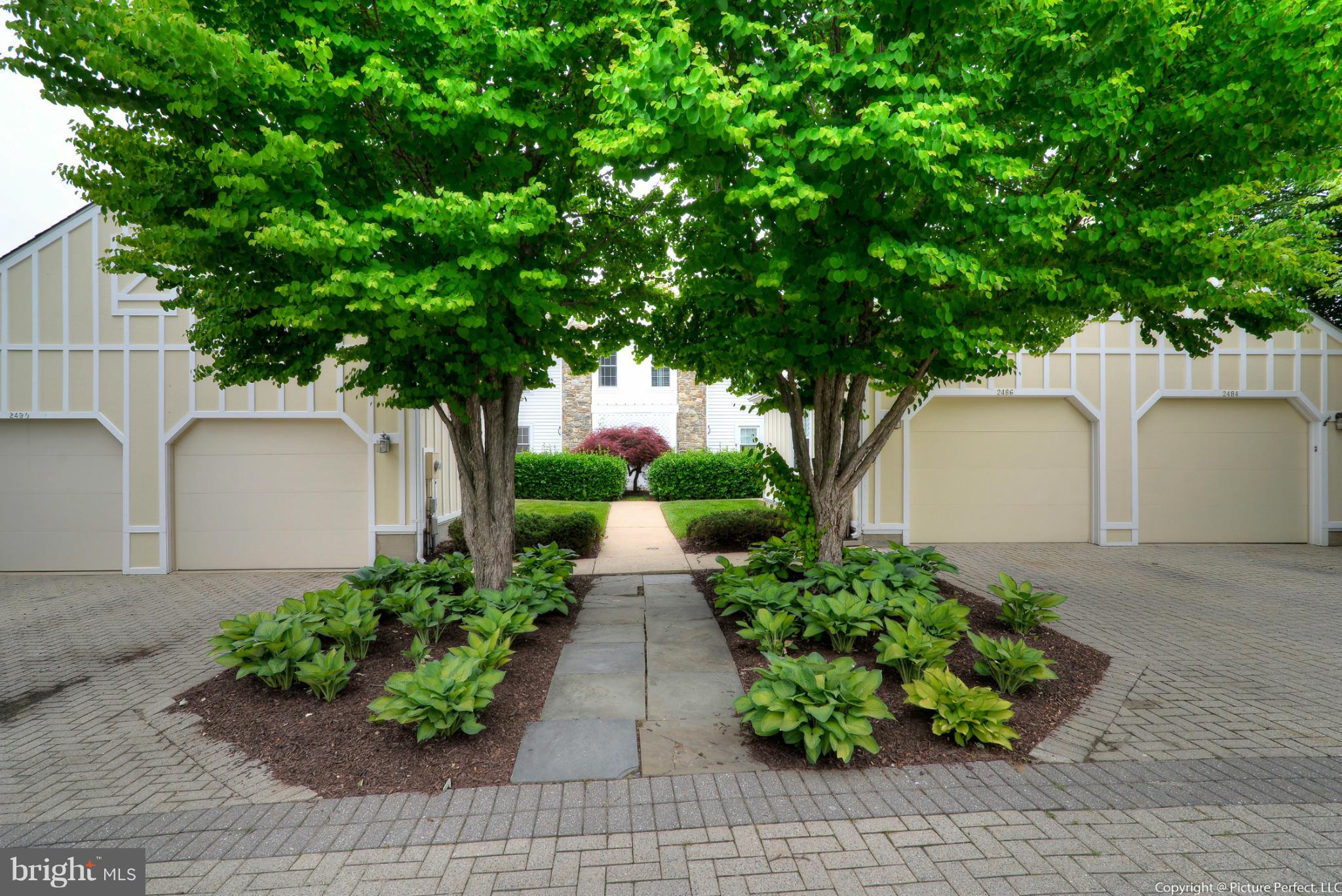 2488 Bear Den Road Frederick, MD 21701 - Photo 25 of 30 a front view of a house with a yard