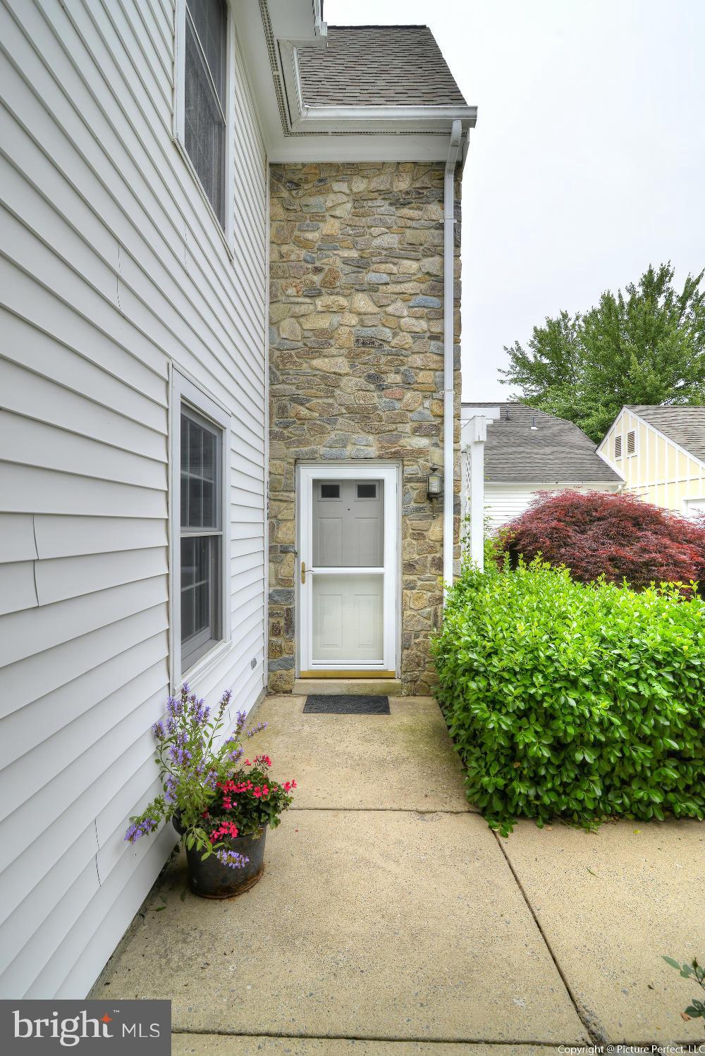 2488 Bear Den Road Frederick, MD 21701 - Photo 4 of 30 a front view of a house with a garden