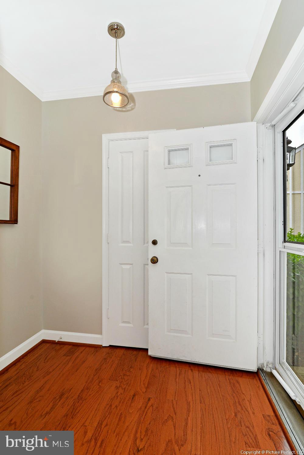 2488 Bear Den Road Frederick, MD 21701 - Photo 5 of 30 a view of empty room with wooden floor and fan