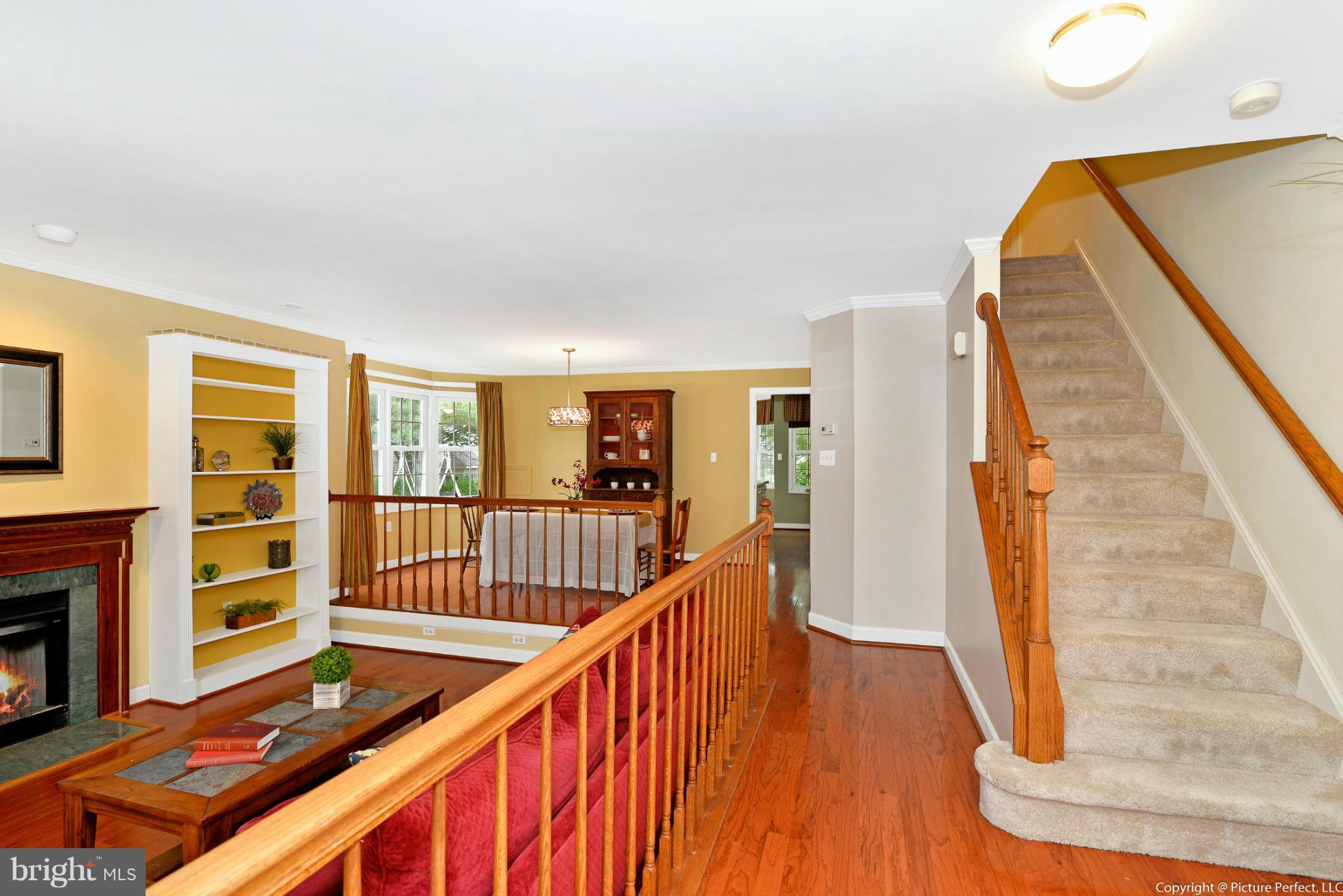 2488 Bear Den Road Frederick, MD 21701 - Photo 30 of 30 a view of a hallway with wooden floor and staircase