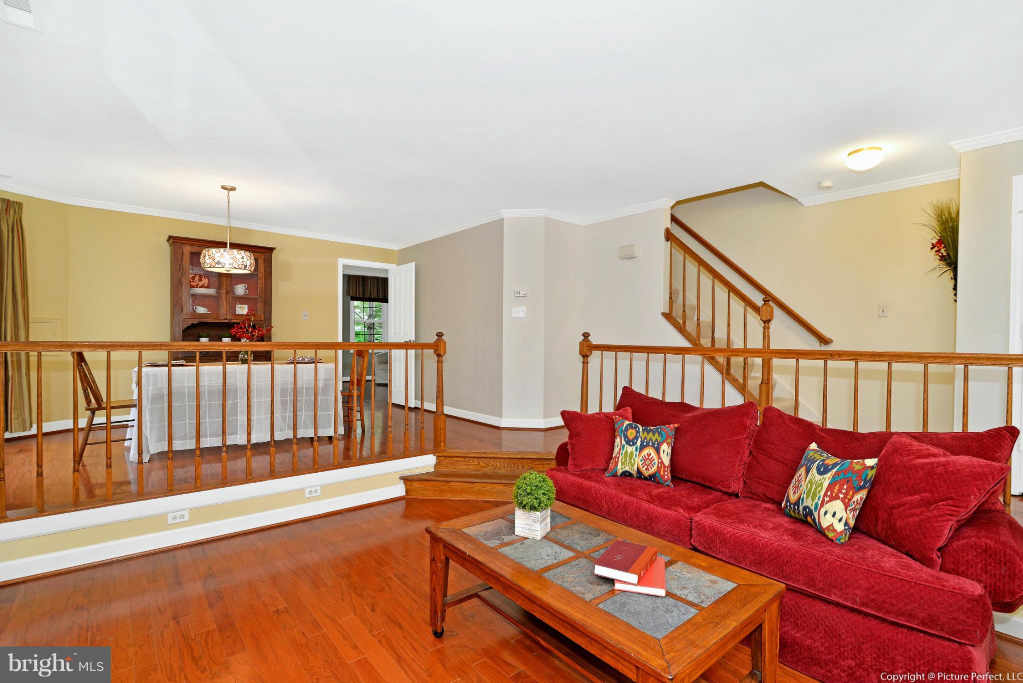 2488 Bear Den Road Frederick, MD 21701 - Photo 6 of 30 a living room with furniture and a wooden floor