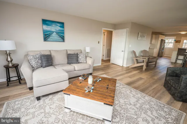 a living room with furniture and a rug