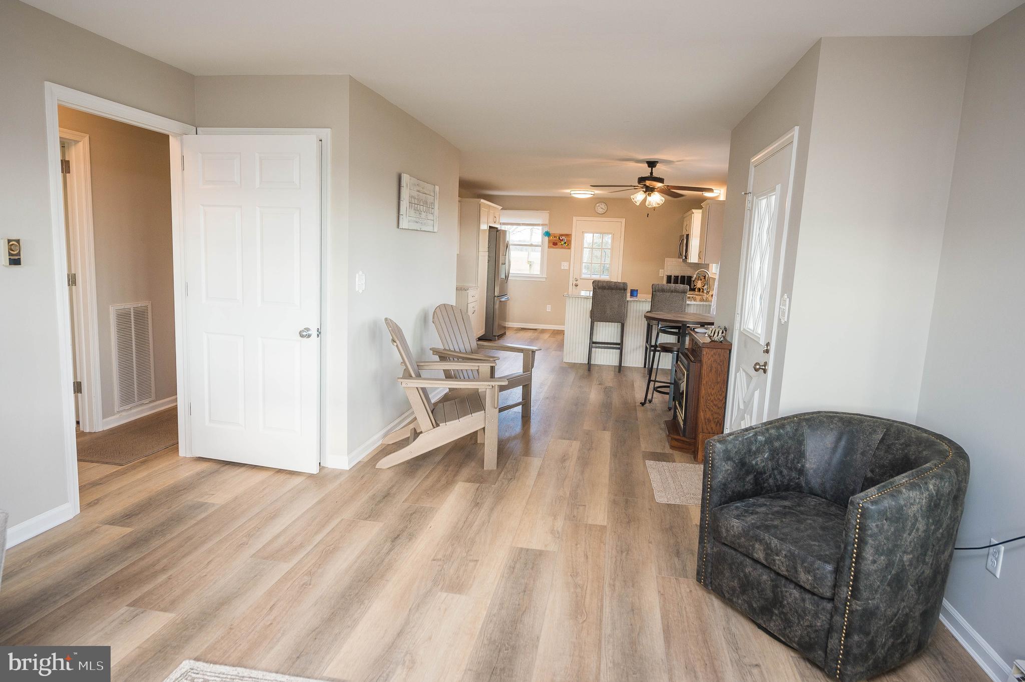 3555 Green Hill Church Road Quantico, MD 21856 - Photo 23 of 51 a living room with furniture and a chandelier
