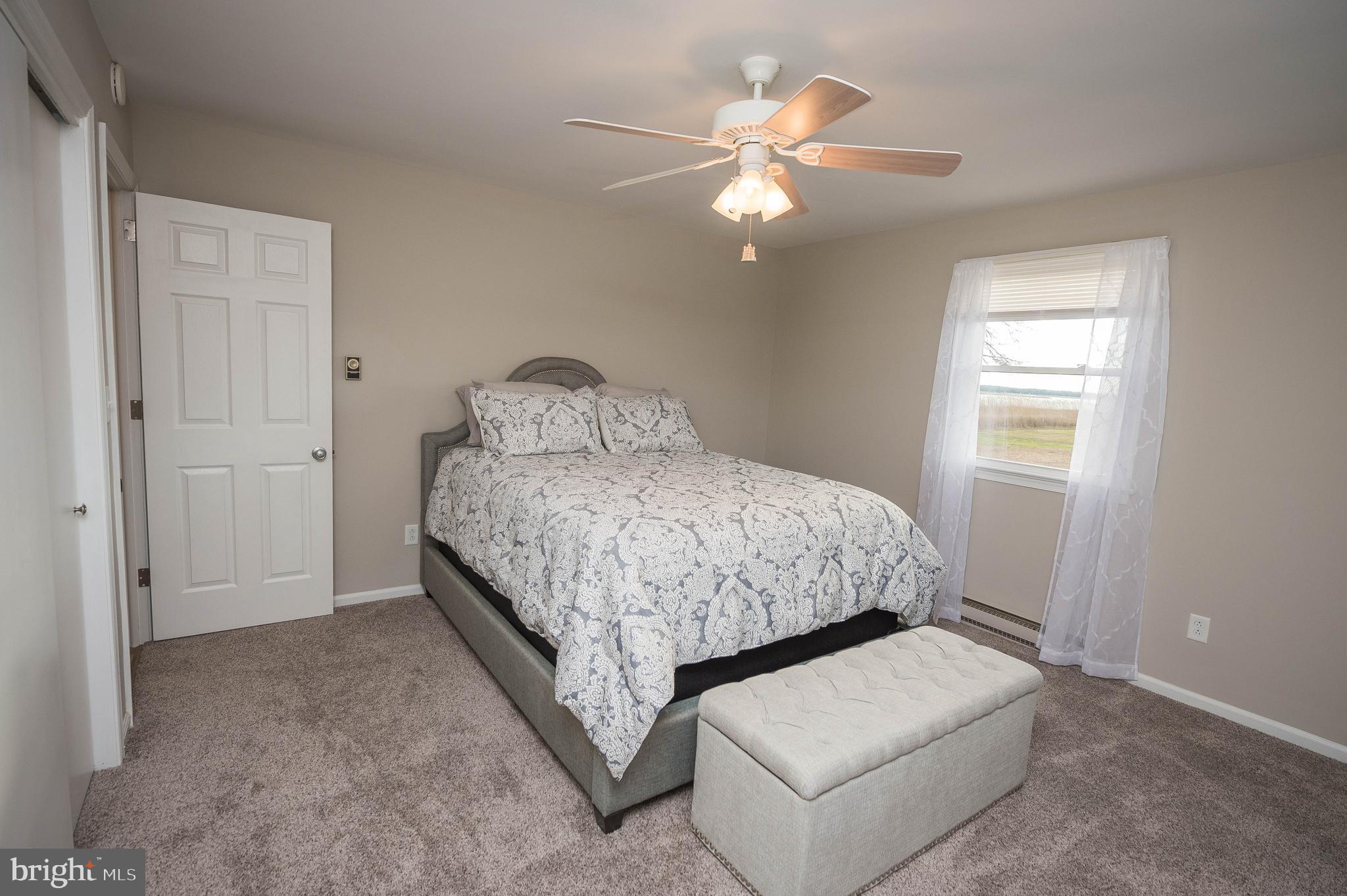 3555 Green Hill Church Road Quantico, MD 21856 - Photo 26 of 51 a room with a bed and a chandelier
