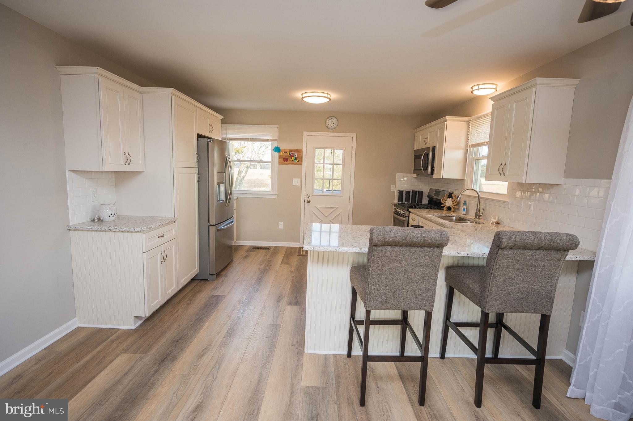 3555 Green Hill Church Road Quantico, MD 21856 - Photo 36 of 51 a view of kitchen with cabinets and wooden floor
