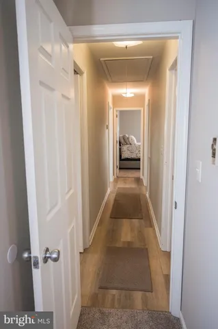 a view of a hallway with a white walls