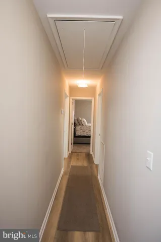 a view of a hallway with a chandelier