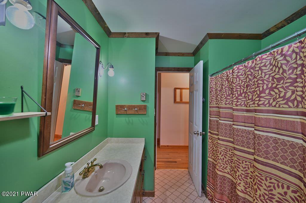 127 Estates Road Greentown, PA 18426 - Photo 21 of 85 a bathroom with a sink and a mirror