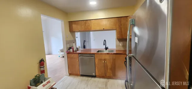 a view of room with wooden floor