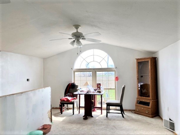 21374 Coleta Road Sterling, IL 61081 - Photo 12 of 19 a living room with furniture a large window and a chandelier