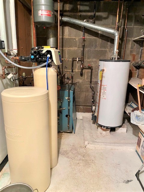 21374 Coleta Road Sterling, IL 61081 - Photo 18 of 19 a room with water heater refrigerator washer and dryer