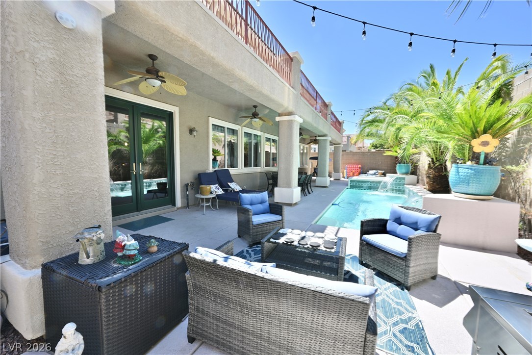 2729 Kildrummie Street Henderson, NV 89044 - Photo 40 of 42 An inviting outdoor living space features a sparkling pool and a covered patio, perfect for relaxation.