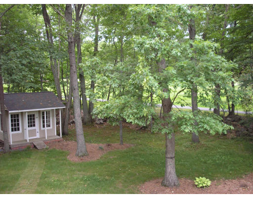 147 Parker Road Framingham, MA 01702 - Photo 11 of 12 a backyard of a house with lots of green space