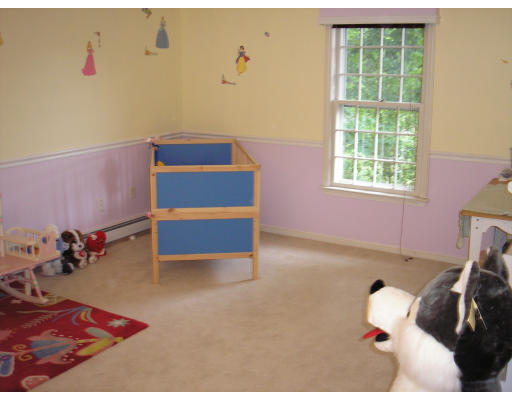 147 Parker Road Framingham, MA 01702 - Photo 9 of 12 a bedroom with a bed and a window
