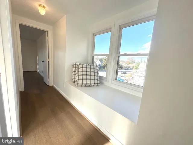a view of entryway with wooden floor