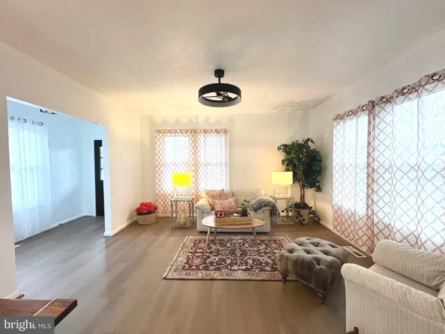 a living room with furniture and window