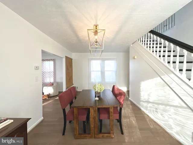 a view of a dining room with furniture and window