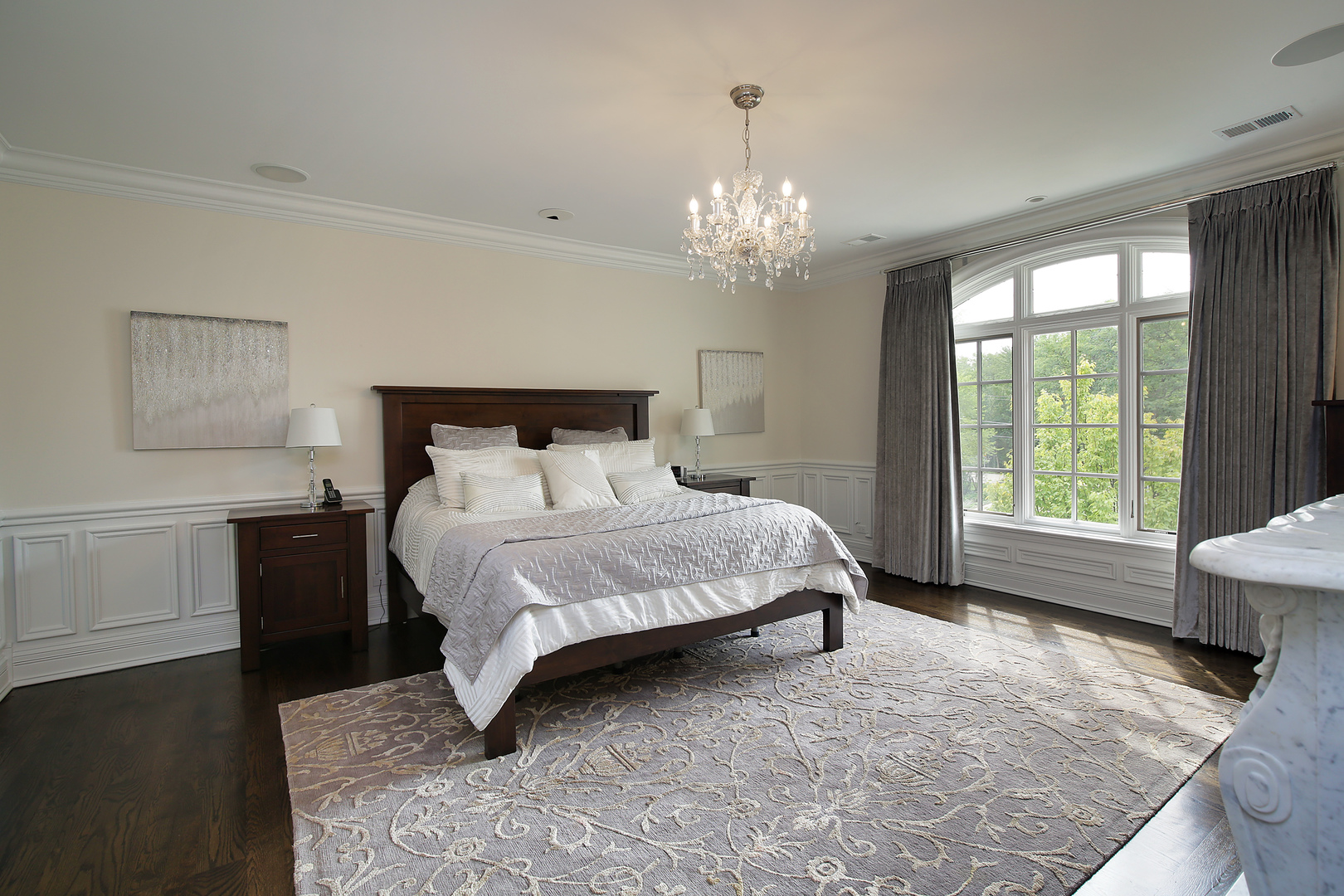 500 Voltz Road Northbrook, IL 60062 - Photo 14 of 35 a spacious bedroom with a bed and a chandelier