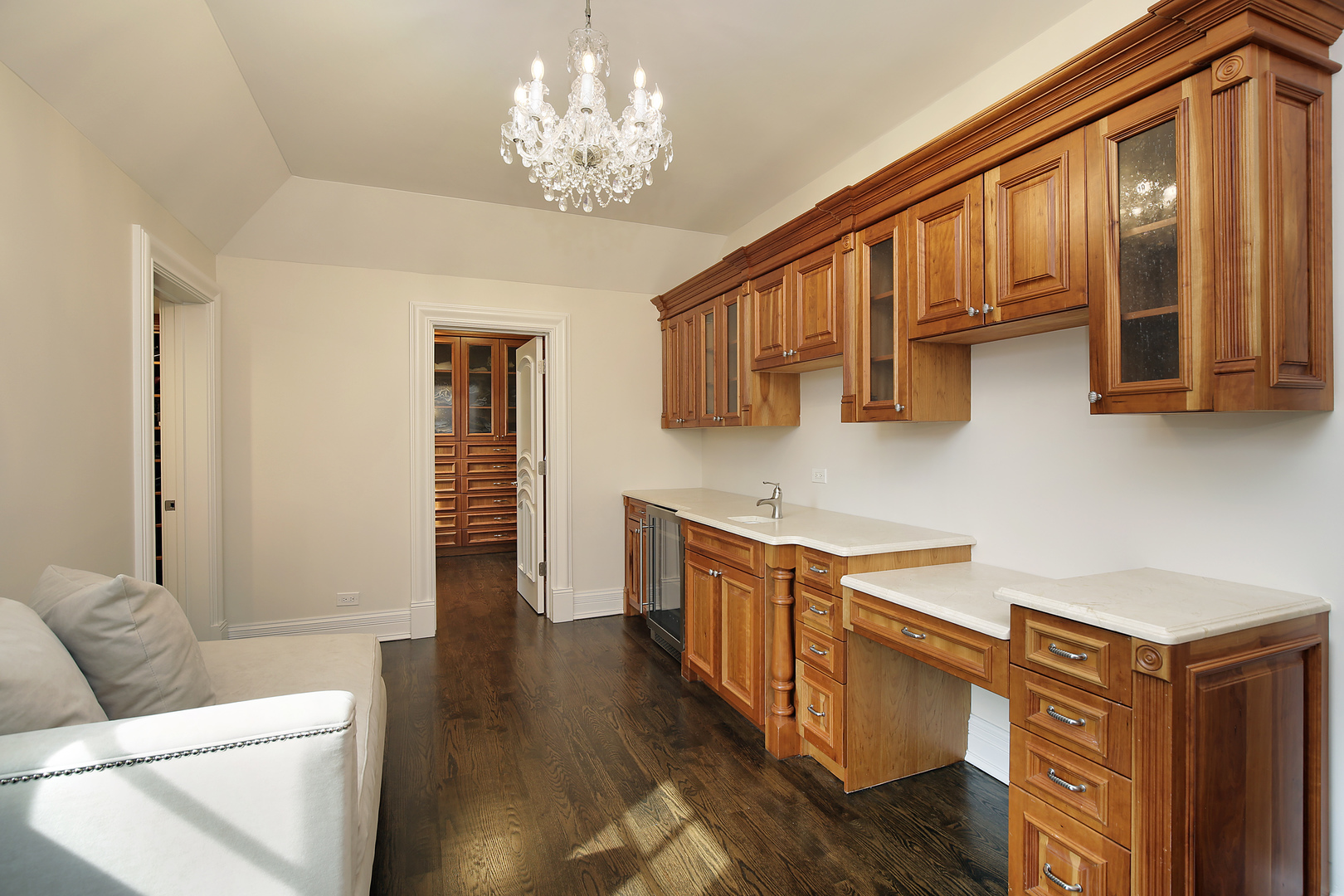 500 Voltz Road Northbrook, IL 60062 - Photo 17 of 35 a kitchen with stainless steel appliances granite countertop a refrigerator a stove a sink dishwasher and wooden cabinets with wooden floor