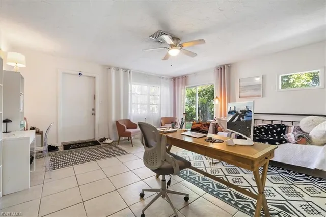 a work room with furniture and window