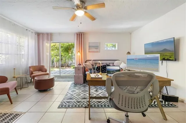 a living room with furniture and a window