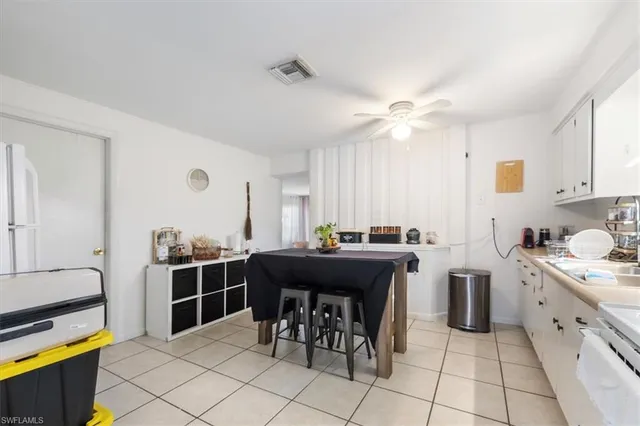a kitchen with stainless steel appliances a stove a sink dishwasher and a refrigerator