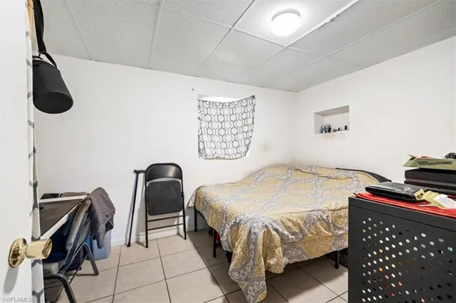 a bedroom with a bed and dresser