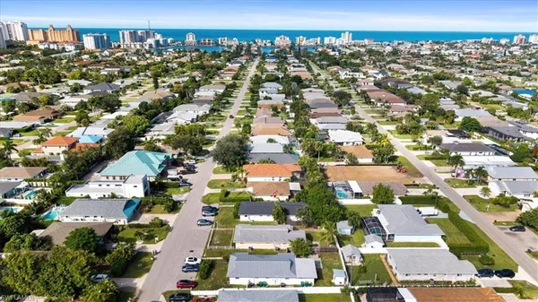 an aerial view of residential houses with outdoor space