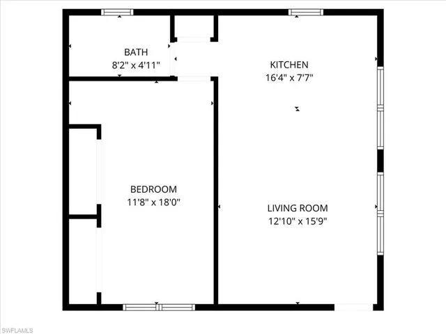 an aerial view of residential building with parking