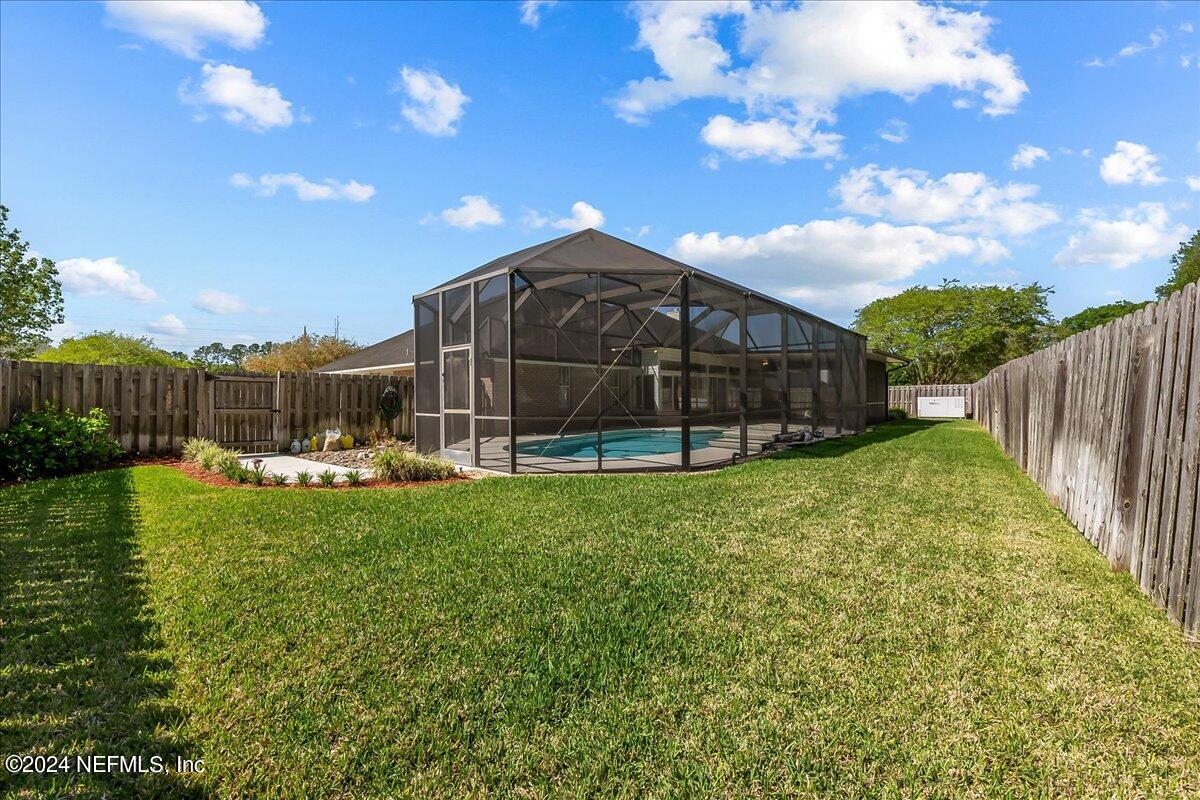 10285 Hamlet Glen Drive Jacksonville, FL 32221 - Photo 25 of 26 a view of a garden