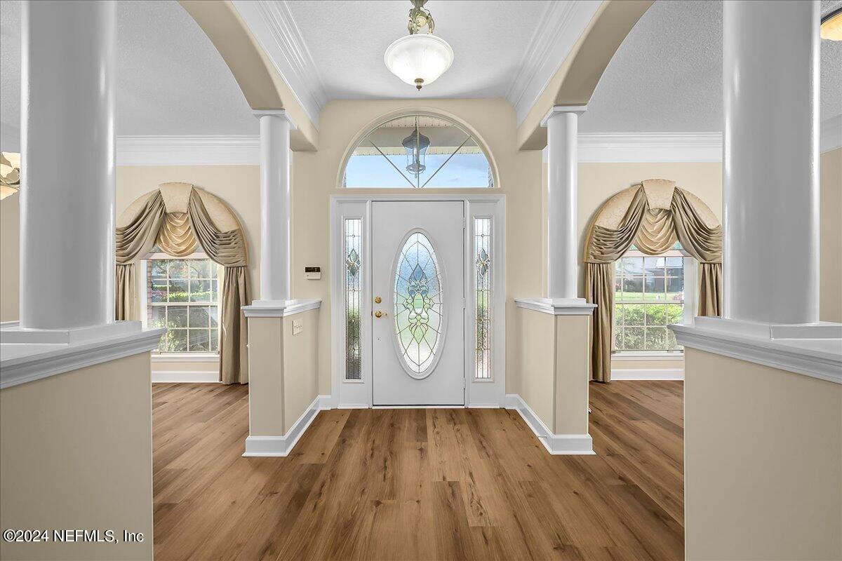 10285 Hamlet Glen Drive Jacksonville, FL 32221 - Photo 5 of 26 a front view of a house with garden