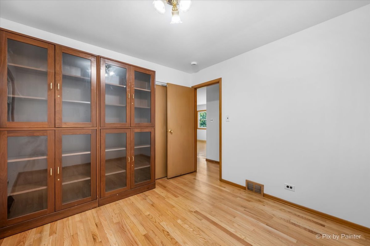970 Fischer Drive Addison, IL 60101 - Photo 18 of 32 a view of an empty room with a cabinet and a window