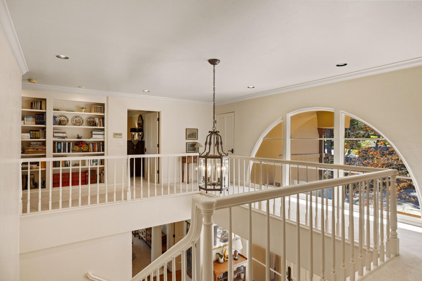 1221 Benbow Place Pebble Beach, CA 93953 - Photo 21 of 39 a view of staircase with white walls and windows