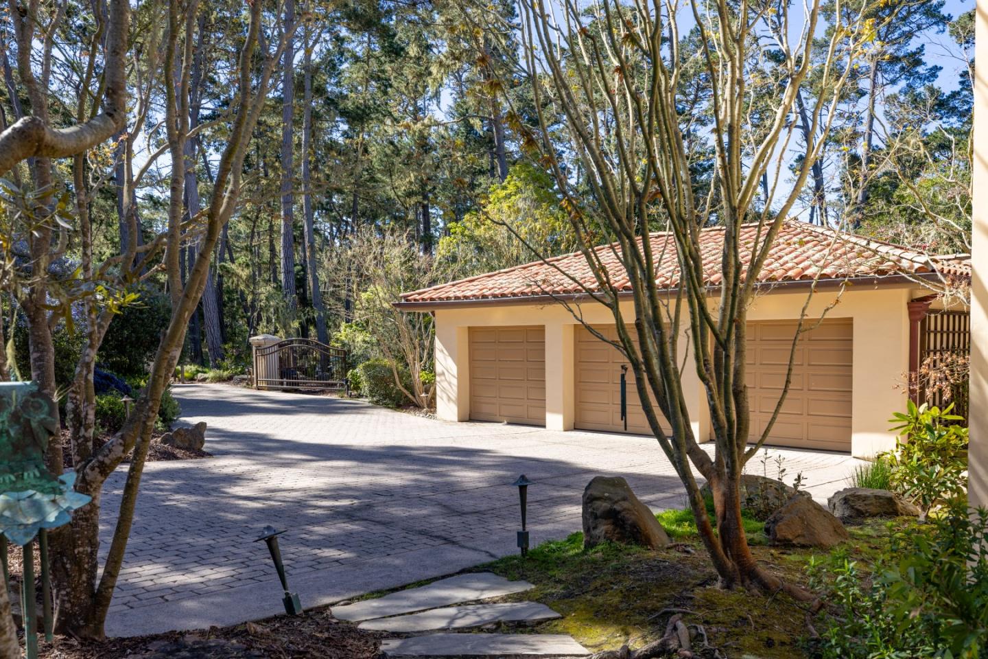 1221 Benbow Place Pebble Beach, CA 93953 - Photo 3 of 39 a house with trees in front of it
