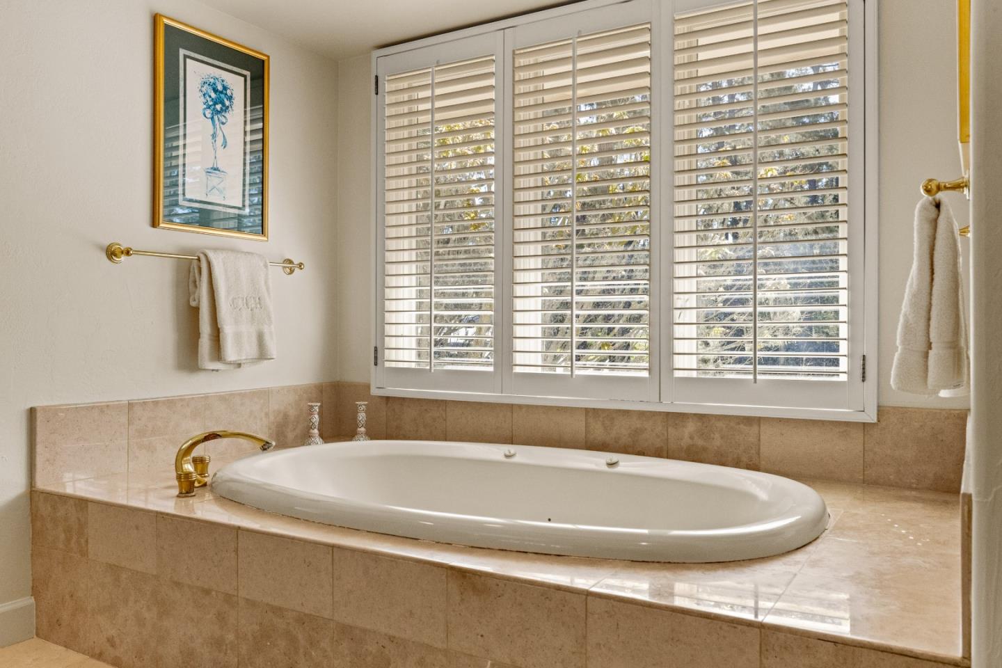 1221 Benbow Place Pebble Beach, CA 93953 - Photo 31 of 39 a bath tub sitting in a bathroom next to a window