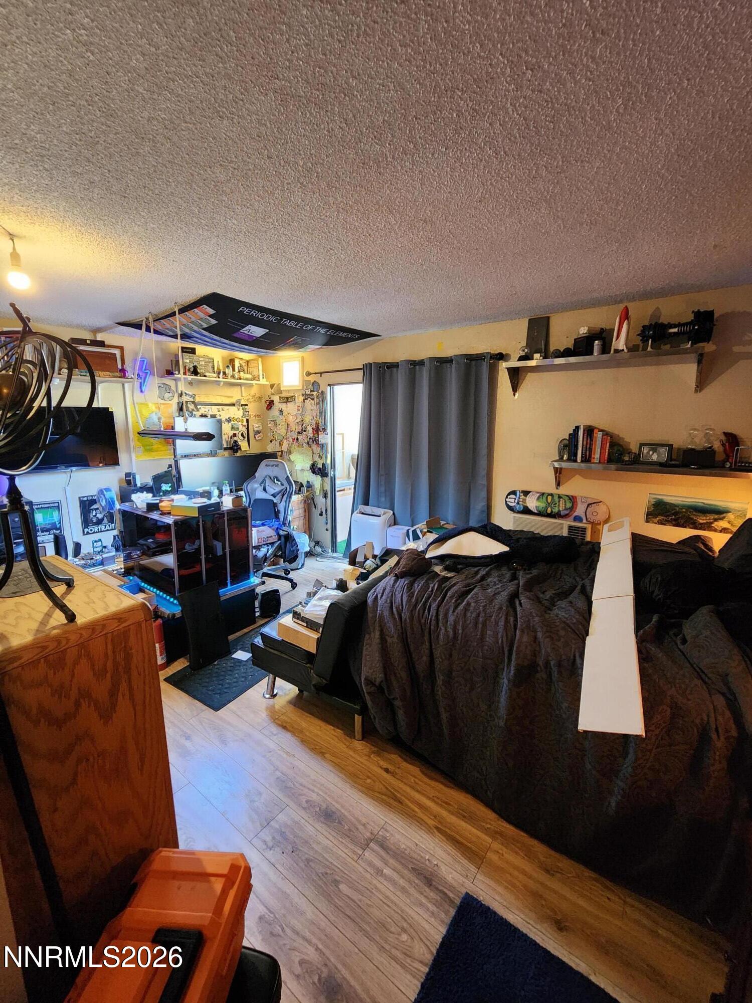 2450 Lymbery Street, Unit 211 Reno, NV 89509 - Photo 12 of 14 a living room with furniture and a window