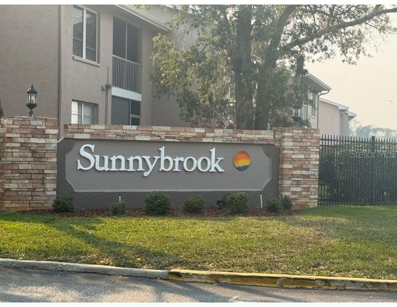 6334 Spring Flower Drive, Unit 14 New Port Richey, FL 34653 - Photo 1 of 25 a view of outdoor space with sign board