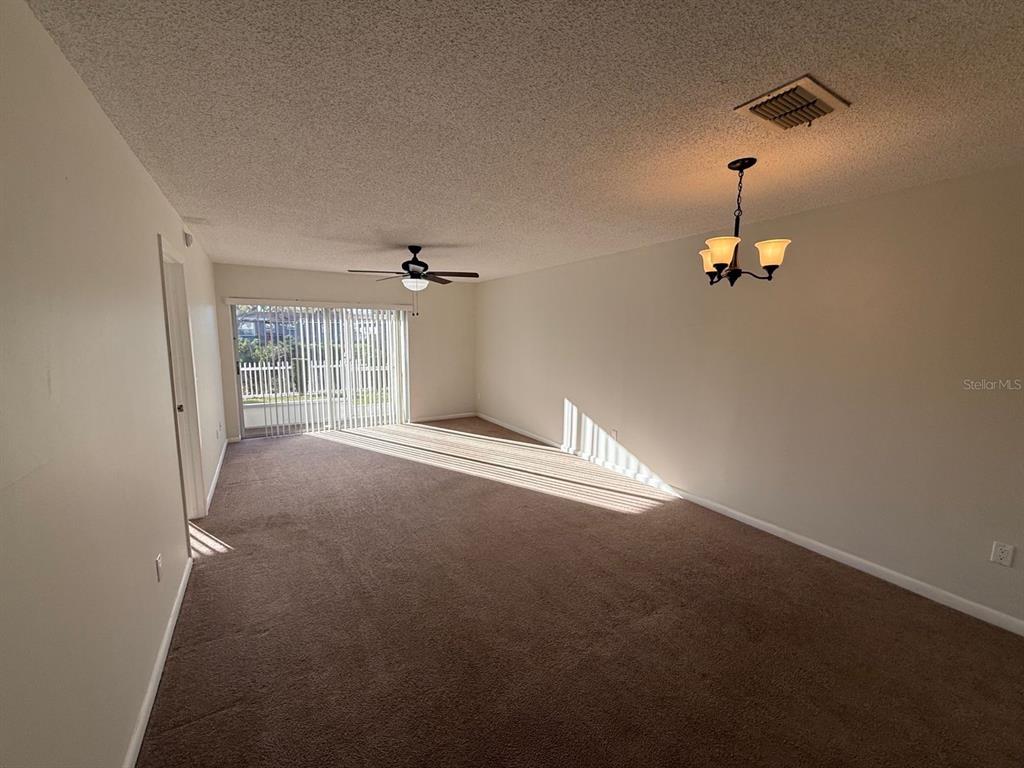 6334 Spring Flower Drive, Unit 14 New Port Richey, FL 34653 - Photo 14 of 25 a view of empty room with windows