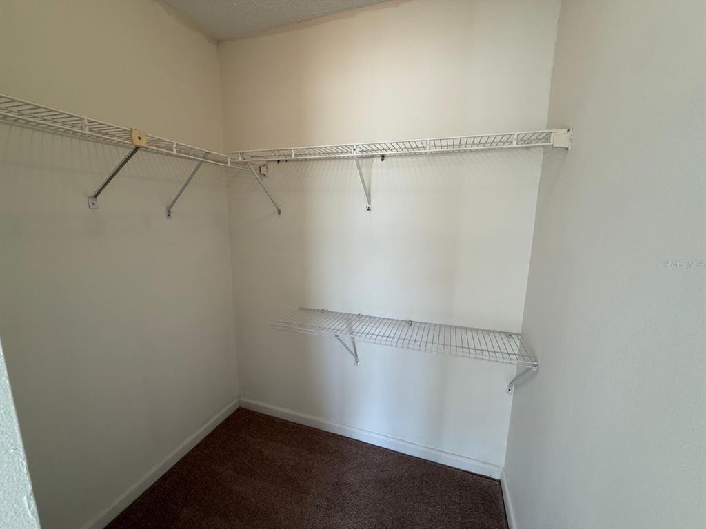 6334 Spring Flower Drive, Unit 14 New Port Richey, FL 34653 - Photo 18 of 25 a view of a room with racks on the wall