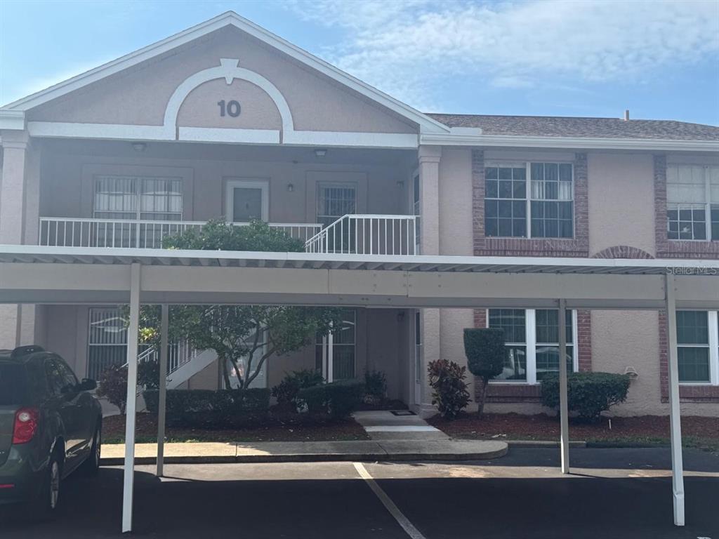 6334 Spring Flower Drive, Unit 14 New Port Richey, FL 34653 - Photo 2 of 25 a front view of a house