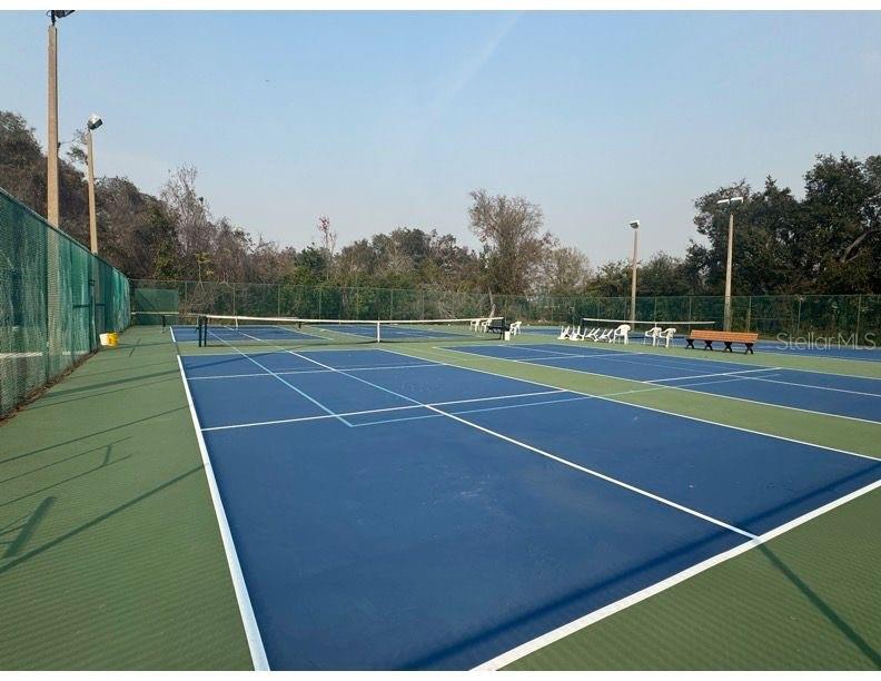6334 Spring Flower Drive, Unit 14 New Port Richey, FL 34653 - Photo 21 of 25 a view of an outdoor space and tennis court