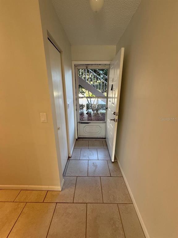 6334 Spring Flower Drive, Unit 14 New Port Richey, FL 34653 - Photo 6 of 25 a view of entryway with stairs