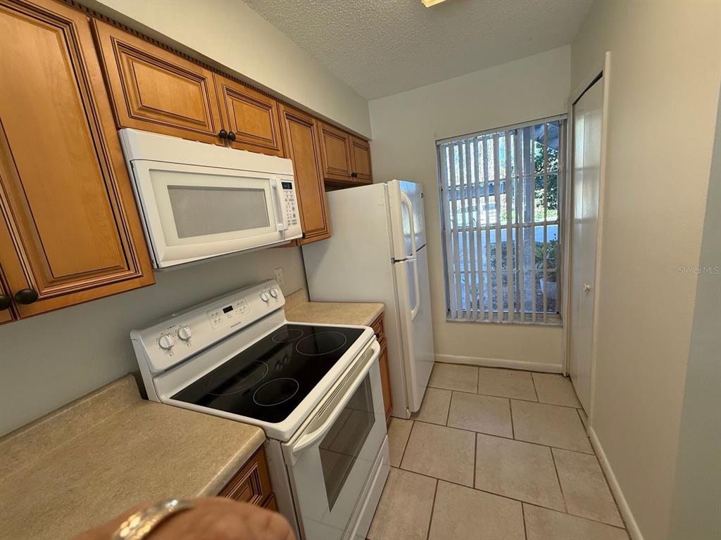 6334 Spring Flower Drive, Unit 14 New Port Richey, FL 34653 - Photo 10 of 25 a utility room with dryer and washer