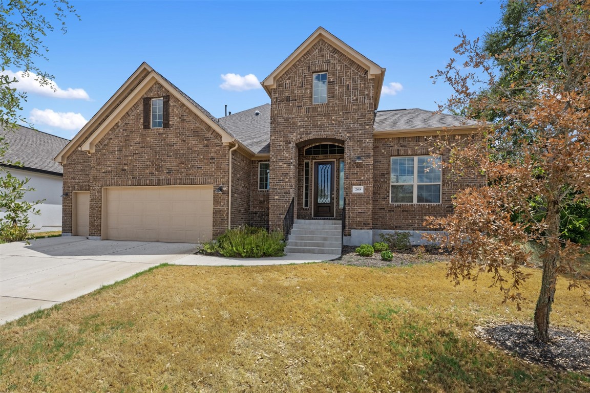 a front view of a house with garden