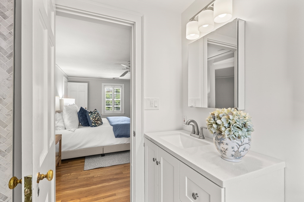 6 Shetland Road Marblehead, MA 01945 - Photo 21 of 39 a en suite bathroom with a granite countertop sink and a mirror